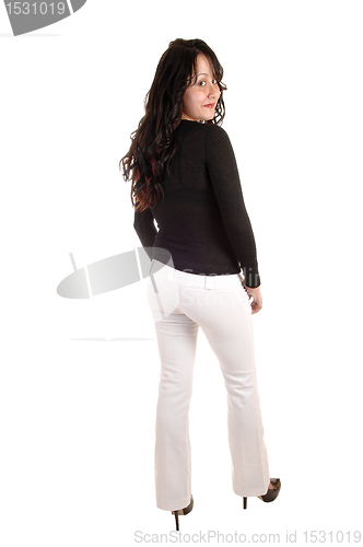 Image of Woman in white dress pants.