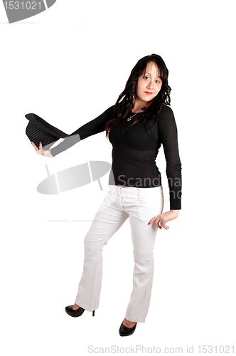 Image of Woman in white pants and had.