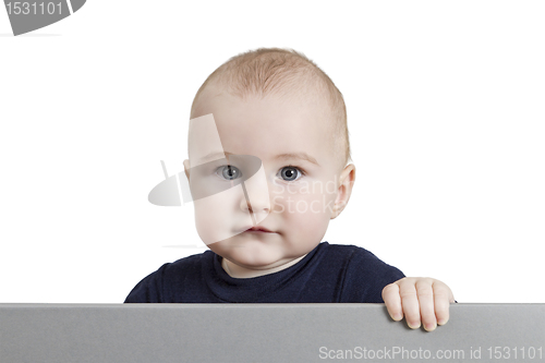 Image of young child holding sign