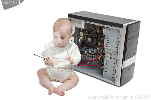 Image of young child working on open computer