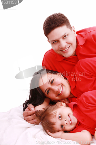 Image of A family portrait of mom, dad and their daughter; isolated on th