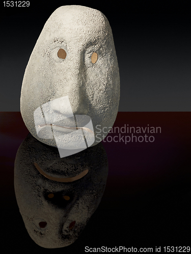 Image of illuminated sad ceramic head