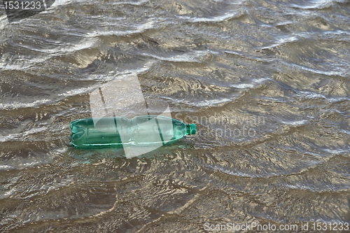 Image of floating green bottle