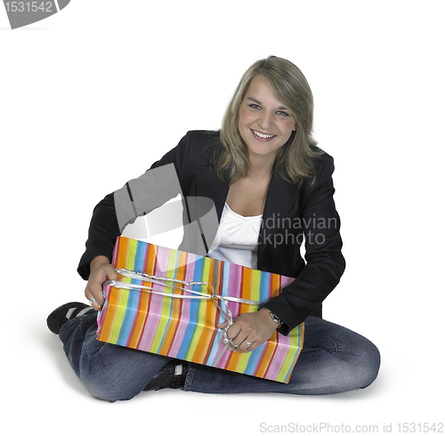 Image of sitting cute girl with present
