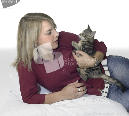 Image of resting blond girl and cat