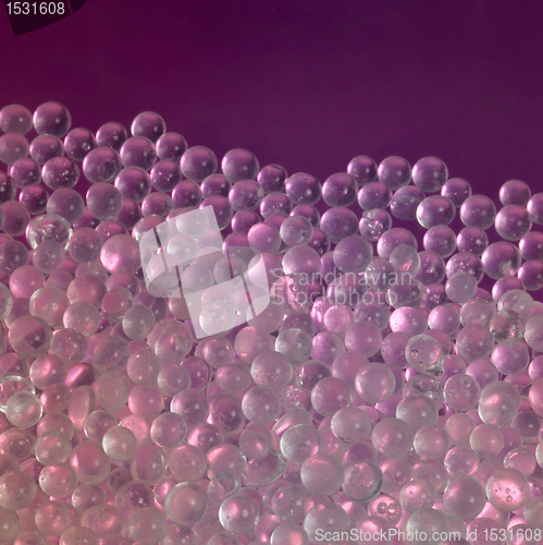 Image of translucent globules in violet back