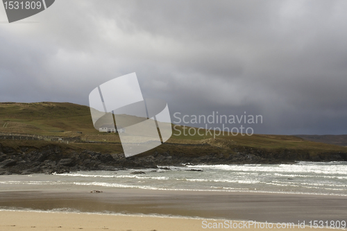 Image of house at the coast with stormy cloud