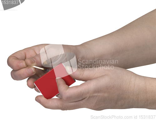 Image of hands while starting a fire