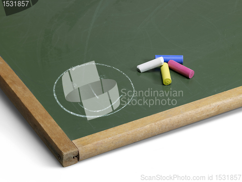 Image of blackboard with smiley and crayons