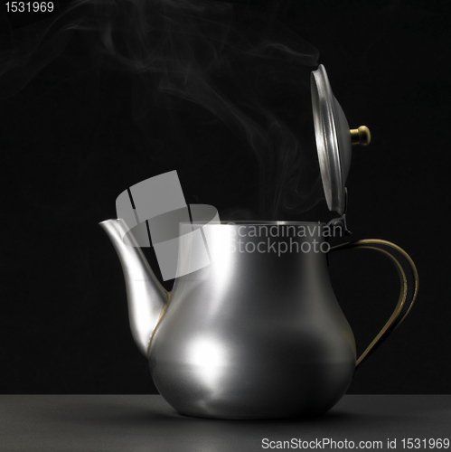 Image of metallic tea pot sideways