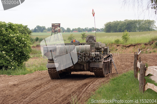 Image of offroad scenery with driving tank