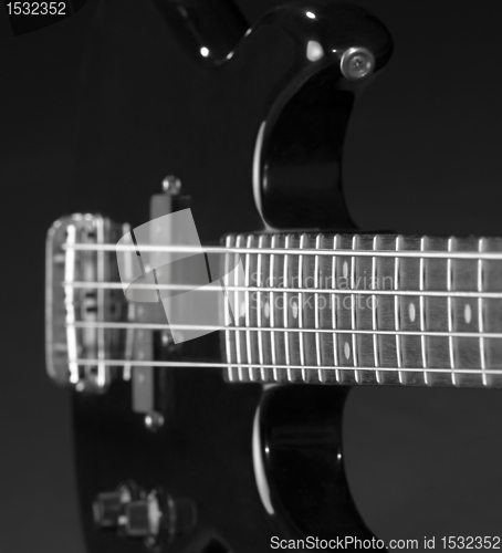 Image of black bass guitar detail