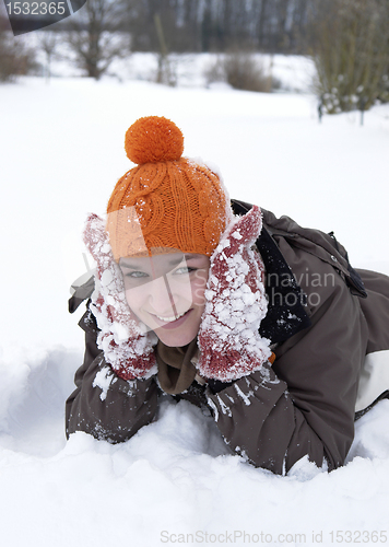 Image of girl in the snow while having fun