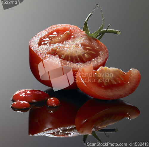 Image of tomato cut and ketchup