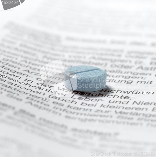 Image of blue pills on package insert