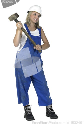 Image of girl dressed in workwear holding a big hammer