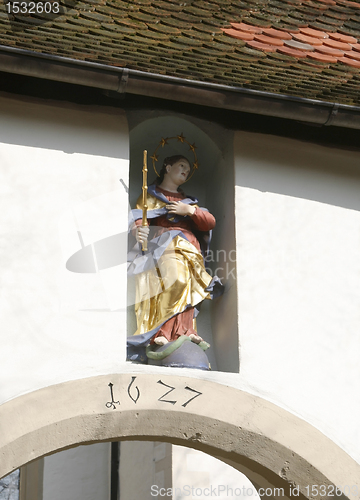 Image of patron saint on a house facade