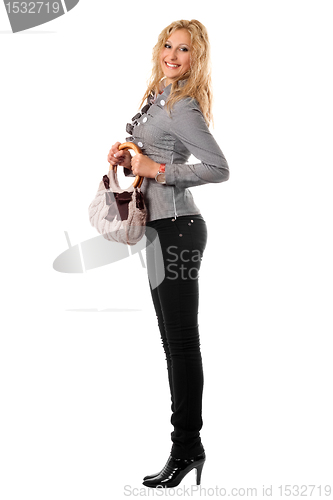 Image of Smiling young blonde with a handbag. Isolated