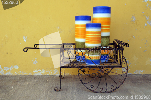 Image of Iron cart with big candles