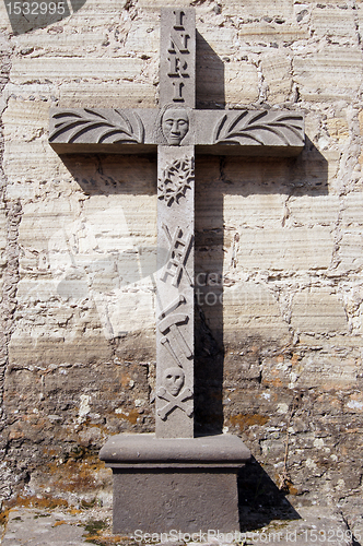 Image of Stone cross near wall