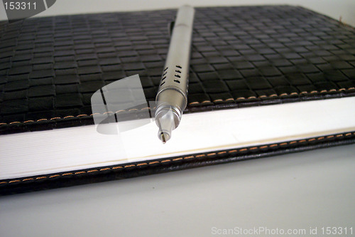 Image of pen on notebook