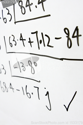 Image of formulas on a whiteboard 