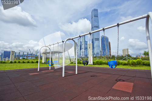 Image of swing in city at day