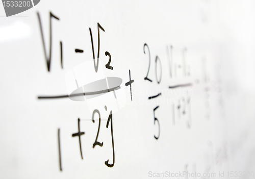 Image of formulas on a whiteboard 