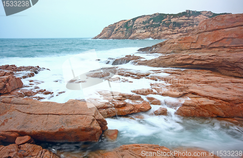 Image of rocky sea coast and blurred water in shek o,hong kong 