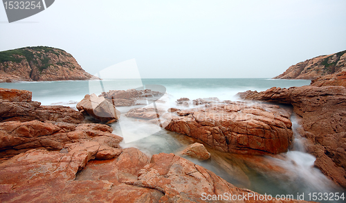 Image of rocky sea coast and blurred water in shek o,hong kong 