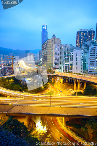 Image of traffic bridge at night