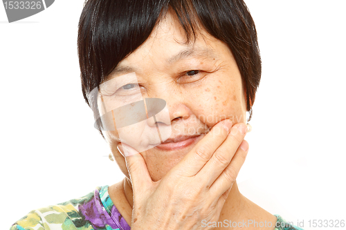 Image of Senior Asian with hand