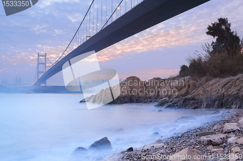 Image of long bridge in sunset hour