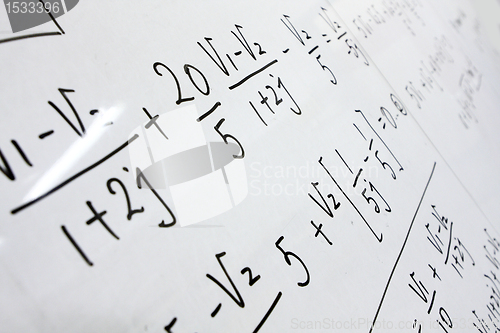 Image of formulas on a whiteboard 