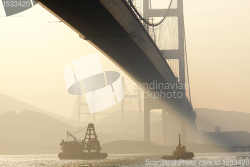 Image of bridge in sunset , under view