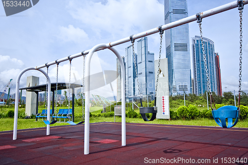 Image of swing in city at day