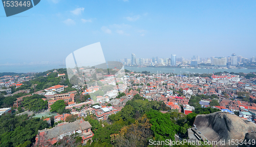 Image of Aerial image of a modern city by a river 