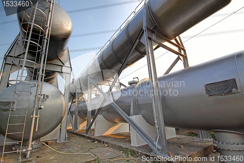 Image of Big gas container against the blue sky 
