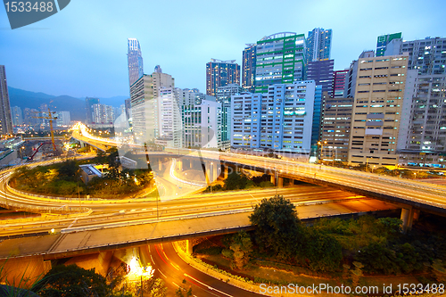 Image of traffic bridge at night