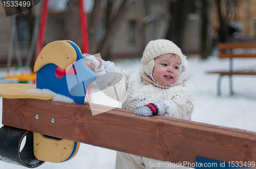 Image of Little girl near the swing