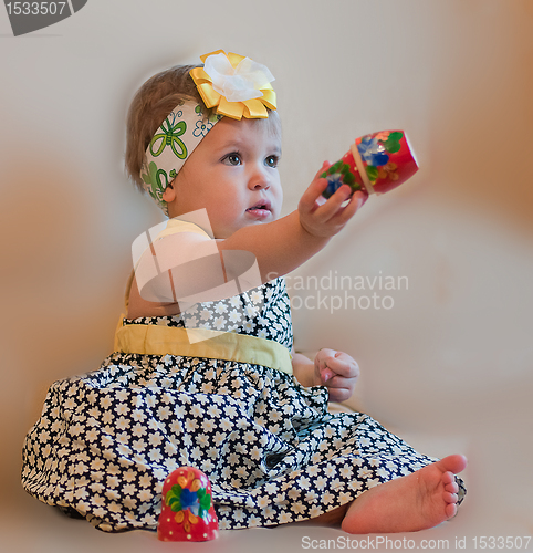 Image of Little girl with matrioshka in her hand