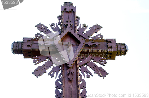 Image of Carved wooden cross with crucified Jesus isolated 