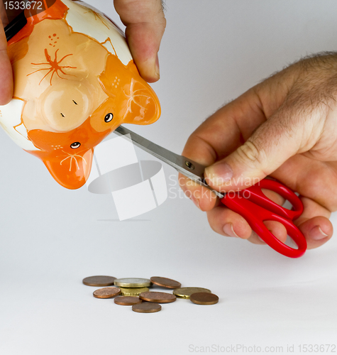 Image of getting money out of piggy bank