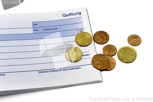 Image of receipt with euro coins and ball-pen