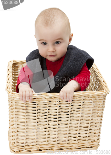 Image of toddler in wickerbasket