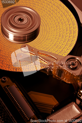 Image of open hard disk with symbolized data