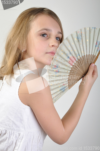 Image of beautiful girl with a fan
