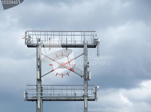 Image of big clock and clouded sky