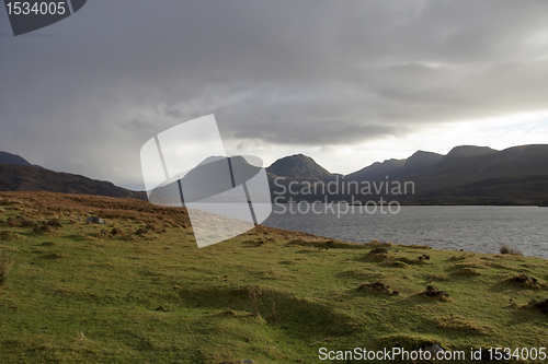 Image of Loch Bad a Gail with dramatic sky