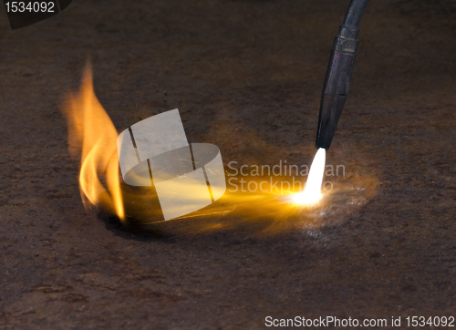 Image of welding torch and flame